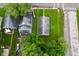Aerial view of a home with a big backyard, surrounded by mature trees at 1802 Sugar Grove Ave, Indianapolis, IN 46202
