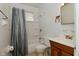 Bathroom includes shower/tub combo, mirror, and wood vanity at 1802 Sugar Grove Ave, Indianapolis, IN 46202
