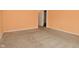 Bedroom featuring tan carpet, peach walls, and ample space for furniture at 1802 Sugar Grove Ave, Indianapolis, IN 46202