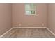 Bedroom featuring carpet flooring, one window, and neutral colored walls at 1802 Sugar Grove Ave, Indianapolis, IN 46202