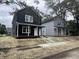 Newly constructed homes with modern exteriors and inviting front porches along a street view at 1802 Sugar Grove Ave, Indianapolis, IN 46202