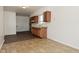 Bright kitchen with wood cabinets, light countertops, and newer flooring at 1802 Sugar Grove Ave, Indianapolis, IN 46202