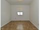Kitchen with light walls, vinyl flooring, and a window at 1802 Sugar Grove Ave, Indianapolis, IN 46202