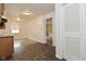 Open kitchen with wood cabinets and newer flooring at 1802 Sugar Grove Ave, Indianapolis, IN 46202