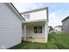 Picture of the home's backyard featuring a covered patio, and a grassy lawn at 1813 Real St, Indianapolis, IN 46240