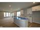 Open concept kitchen features a large island, ample counter space, and sleek white cabinetry at 1813 Real St, Indianapolis, IN 46240
