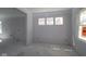 Bright living room space is highlighted by natural light through windows, offering a versatile area for relaxation and entertaining at 1813 Real St, Indianapolis, IN 46240