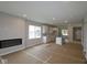 Open-concept living area features fireplace and view into the kitchen and dining areas at 1813 Real St, Indianapolis, IN 46240