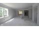 Spacious living room features abundant natural light, open layout, and neutral walls, perfect for creating a welcoming atmosphere at 1813 Real St, Indianapolis, IN 46240