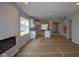 Open-concept living area features fireplace and view into the kitchen and dining areas at 1813 Real St, Indianapolis, IN 46240