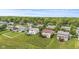 A high angle view shows well maintained homes in a suburban neighborhood with mature trees and expansive lawns at 1821 Midnight Pass, Brownsburg, IN 46112