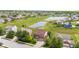 An aerial view reveals a well-planned community with ponds, green spaces, and manicured lawns at 1821 Midnight Pass, Brownsburg, IN 46112