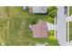 An aerial view captures the layout of the home, showcasing its deck, landscaping, and surrounding neighborhood at 1821 Midnight Pass, Brownsburg, IN 46112