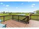 A spacious back deck overlooks a scenic pond, providing a relaxing outdoor living space at 1821 Midnight Pass, Brownsburg, IN 46112