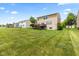 A sprawling green backyard with a deck offers plenty of space for outdoor activities and relaxation at 1821 Midnight Pass, Brownsburg, IN 46112