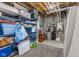 Unfinished basement with exposed ceiling, gray carpeting, and heavy duty shelving for ample storage at 1821 Midnight Pass, Brownsburg, IN 46112