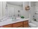 Bright bathroom featuring a vanity with a white marble countertop and decorative accents at 1821 Midnight Pass, Brownsburg, IN 46112