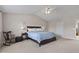 Large bedroom with comfortable bed, ceiling fan, and ample natural light from the windows at 1821 Midnight Pass, Brownsburg, IN 46112