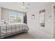 Neutral bedroom with large window and fan at 1821 Midnight Pass, Brownsburg, IN 46112