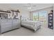 bedroom with ceiling fan and large window for natural light at 1821 Midnight Pass, Brownsburg, IN 46112