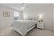 A bright bedroom features a ceiling fan and a large window at 1821 Midnight Pass, Brownsburg, IN 46112