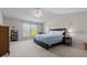 Spacious primary bedroom featuring large windows, neutral walls, and a ceiling fan at 1821 Midnight Pass, Brownsburg, IN 46112