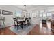 Dining room with modern lighting and elegant furniture, seamlessly flowing into the living space at 1821 Midnight Pass, Brownsburg, IN 46112