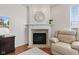 Elegant fireplace with decorative mantel, adding warmth and character to the living space at 1821 Midnight Pass, Brownsburg, IN 46112