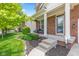 Inviting front porch with charming chairs and colorful flower boxes, showcasing curb appeal at 1821 Midnight Pass, Brownsburg, IN 46112