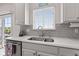 Close up of a bright kitchen featuring stainless steel appliances, neutral color palette and lots of natural light at 1821 Midnight Pass, Brownsburg, IN 46112