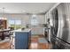 Bright kitchen featuring stainless steel appliances, center island, and hardwood floors with an eat in kitchen at 1821 Midnight Pass, Brownsburg, IN 46112