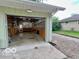 Spacious garage area featuring wood shelving and natural light at 1834 Chandler Ln, Columbus, IN 47203