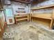 Functional garage featuring work bench, built-in shelving, and ample storage space at 1834 Chandler Ln, Columbus, IN 47203