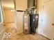 Neutral utility room with water heater and furnace visible near door at 1834 Chandler Ln, Columbus, IN 47203