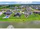 Beautiful aerial view of homes on a pond with manicured lawns in a lovely neighborhood at 18398 Cross Lakes Ct, Westfield, IN 46074