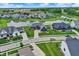 Aerial view of the home in a neighborhood with a pond and beautifully maintained lawns at 18398 Cross Lakes Ct, Westfield, IN 46074