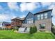 Backyard of new construction home features a screened porch, patio, and lush landscaping at 18398 Cross Lakes Ct, Westfield, IN 46074