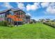 Backyard with a screened in porch, patio area, and a spacious lawn with fence at 18398 Cross Lakes Ct, Westfield, IN 46074