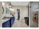 This spacious bathroom features double sinks, a luxurious soaking tub, and a glass-enclosed shower at 18398 Cross Lakes Ct, Westfield, IN 46074