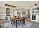 Dining area with modern light fixture and easy access to the kitchen and wet bar at 18398 Cross Lakes Ct, Westfield, IN 46074