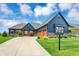 Charming front exterior featuring a blue home with a well-maintained lawn and driveway at 18398 Cross Lakes Ct, Westfield, IN 46074