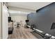 Basement home gym is equipped with a treadmill, weights, and space for exercise at 18398 Cross Lakes Ct, Westfield, IN 46074