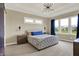 Bright and airy bedroom with scenic backyard view, comfortable bed, and modern decor at 18398 Cross Lakes Ct, Westfield, IN 46074