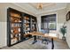 Home office featuring a desk and a custom bookcase at 18398 Cross Lakes Ct, Westfield, IN 46074