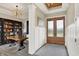 Home office featuring a desk, bookshelves, and a beautiful entry at 18398 Cross Lakes Ct, Westfield, IN 46074