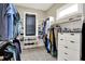 A large walk-in closet with rows of shelving and hanging racks to maximize storage and organization at 18398 Cross Lakes Ct, Westfield, IN 46074