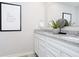 Bright bathroom features granite countertops, a large mirror, and modern fixtures, providing a clean and elegant design at 18736 Moray St, Westfield, IN 46074