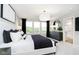 Bright bedroom featuring large windows, sleek furnishings, and plush bedding for a restful retreat at 18736 Moray St, Westfield, IN 46074