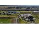 An aerial view of a community featuring a golf course, pond, clubhouse, and rows of suburban homes at 201 St Andrews Ave, Edinburgh, IN 46124