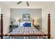 Comfortable bedroom features a four-poster bed, side tables, and classic design at 201 St Andrews Ave, Edinburgh, IN 46124